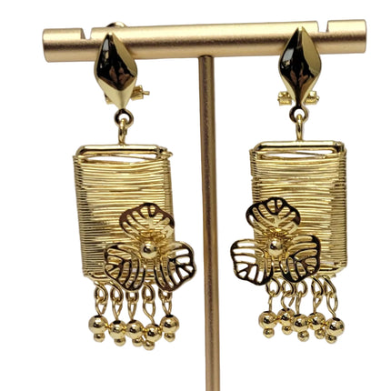 Gold earrings on a white background