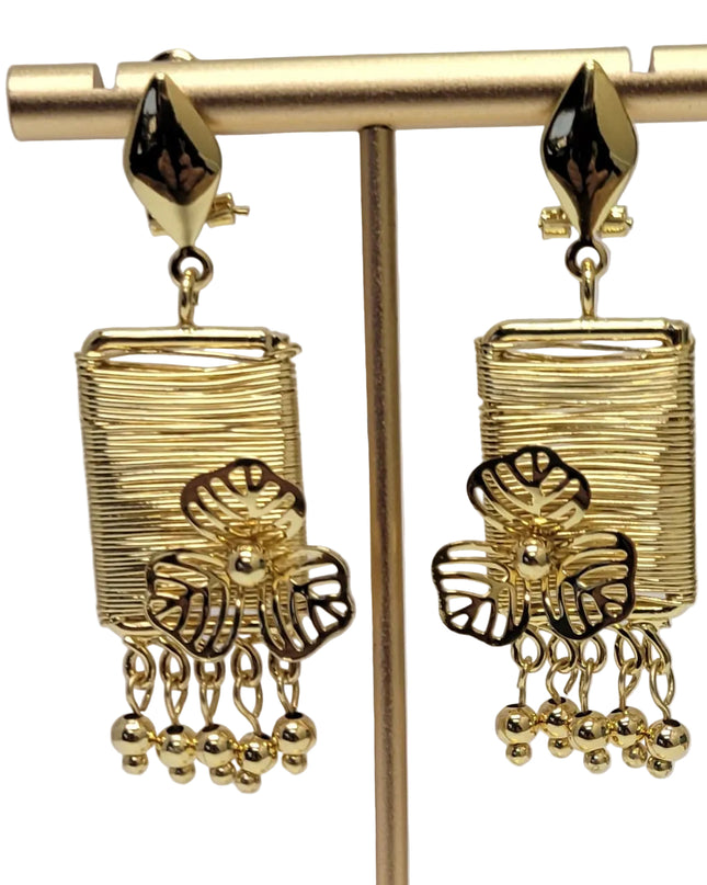 Gold earrings on a white background