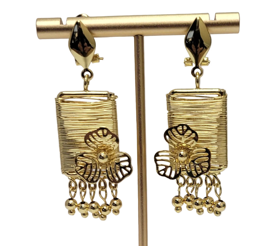 Gold earrings on a white background